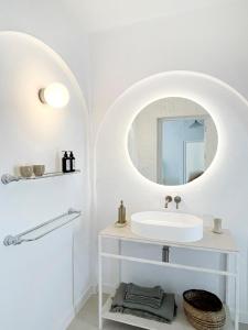 a white bathroom with a sink and a mirror at NEW villa - luxury, views, hot tub, pool, 8 plus sofabed in Cómpeta