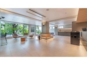 a large living room with chairs and a table at Sun Hotel Fukuyama - Vacation STAY 53476v in Fukuyama +33 photos