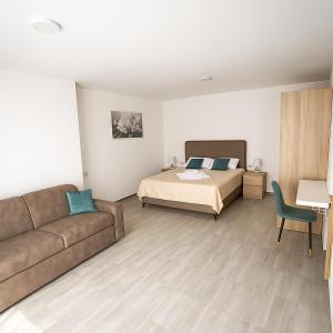 Postel nebo postele na pokoji v ubytování A&A Apartments