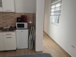 Kuchyň nebo kuchyňský kout v ubytování A&A Apartments