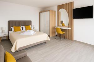 Postel nebo postele na pokoji v ubytování A&A Apartments