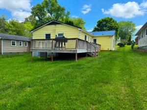 a deck in the yard of a house at Centralized Modern Home in Johnson City in Johnson City