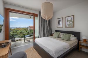 a bedroom with a bed and a large window at Vila Oliva i Terakota in Mandre +32 photos
