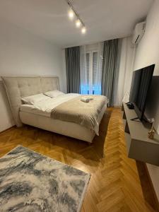Postel nebo postele na pokoji v ubytování Arena Mila