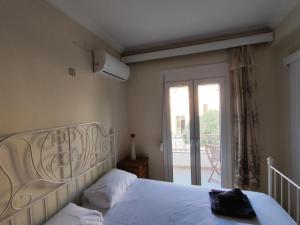 Postel nebo postele na pokoji v ubytování Port House Apartment