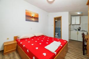 Postel nebo postele na pokoji v ubytování Apartments Jase