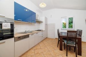 Kuchyň nebo kuchyňský kout v ubytování Apartment Toma