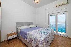 Postel nebo postele na pokoji v ubytování Apartment Toma