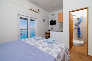 Postel nebo postele na pokoji v ubytování Apartment Toma