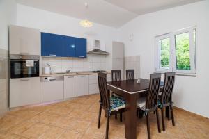 Kuchyňa alebo kuchynka v ubytovaní Apartment Toma