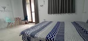 Postel nebo postele na pokoji v ubytování Yu Hai B&B