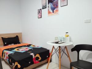 Postel nebo postele na pokoji v ubytování Yu Hai B&B