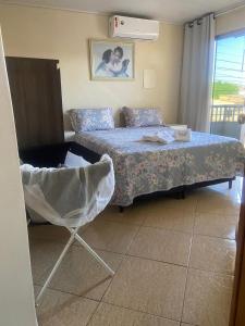 Ένα ή περισσότερα κρεβάτια σε δωμάτιο στο Apartamento Canaã