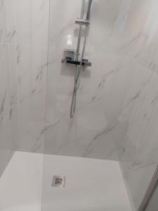 a bathroom with a shower with a glass door at Queen apartment in Ravenna