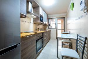 a small kitchen with a sink and a counter at Luminoso piso en La Laguna by CABANA Rentals in La Laguna