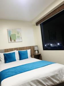Postel nebo postele na pokoji v ubytování Hotel Suites La Fontana