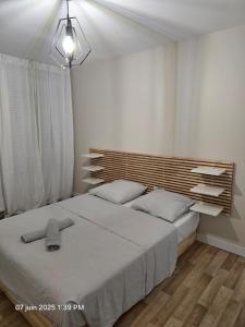 Postel nebo postele na pokoji v ubytování T2 cosy, calme avec balcon et parking