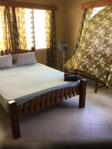 Postel nebo postele na pokoji v ubytování Navaqiqi Apartments