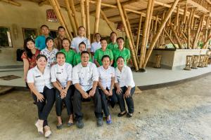 a group of people posing for a picture at Ecolodge Bukit Lawang in Bukit Lawang