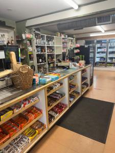 a grocery store aisle with shelves filled with food at Nestledown B&B in Halfmoon Bay