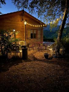 a house with a group of chairs and lights at Gîte Le Domaine de Valko in Castanet-le-Haut