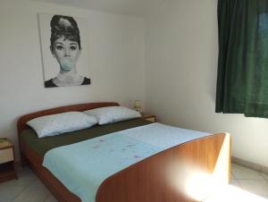 Postel nebo postele na pokoji v ubytování Apartments with parking spaces Orebic, Peljesac - 643