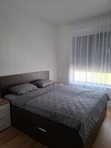 Postel nebo postele na pokoji v ubytování Penthouse Ika + 22 fotografií