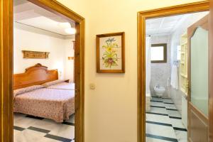 Postel nebo postele na pokoji v ubytování Hotel Rosa