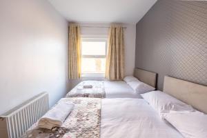 Postel nebo postele na pokoji v ubytování Brick Hotel