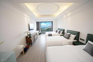 Televisor o centre d'entreteniment de PingTan YuCheng Seaview Blue Smart Hotel