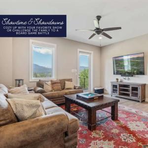 a living room with a couch and a table at Peak View Paradise in Fraser