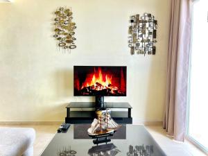 a living room with a fireplace on the wall at Coastal Elegance - Bella Vista in Cabo Negro