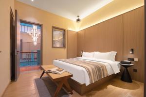 Postel nebo postele na pokoji v ubytování Mudita Hotel + 37 fotografií