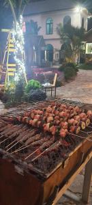 a grill with lots of food on it at Trang An Green Bungalow & Restaurant in Ninh Binh