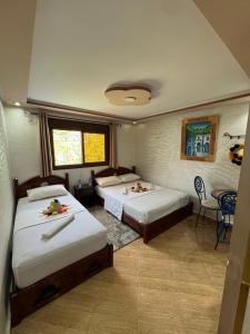 Postel nebo postele na pokoji v ubytování Hotel nabil