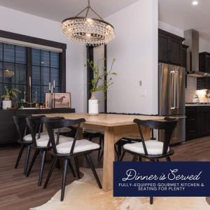 a kitchen with a large wooden table and chairs at Rocky Mountain Retreat in Winter Park