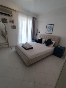 Ένα ή περισσότερα κρεβάτια σε δωμάτιο στο Kariani Sea View Apartment