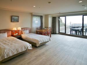 Voodi või voodid majutusasutuse Izumigo AMBIENT Izu-Kogen Condominium toas