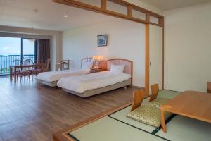 Voodi või voodid majutusasutuse Izumigo AMBIENT Izu-Kogen Condominium toas