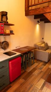 a kitchen with a table and a couch in a room at Casa Dabne in San Cristóbal de Las Casas +26 photos