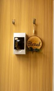 a sign that says blessed hanging on a wall at JJJ's Ranch Farm 1 by Tiny Away in Koolboo
