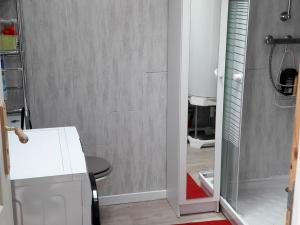 a small bathroom with a shower and a white refrigerator at Le Croisic : Maison 4-6 Pers Climatisée avec Terrasse - FR-1-843-7 in Le Croisic