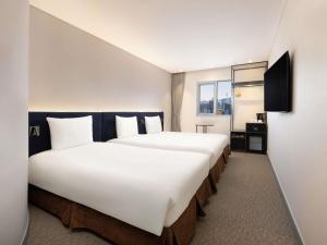ibis Ambassador Seoul Insadong-Newly renovated in 2025にあるベッド