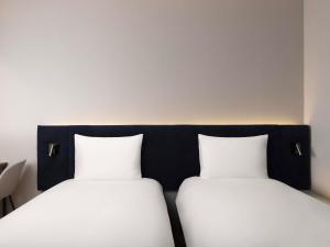 ibis Ambassador Seoul Insadong-Newly renovated in 2025にあるベッド