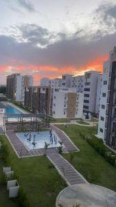 a view of a city with buildings and a park at Ronya One Bedroom Pool and Barbacoa Las Canas Residential Close to the Airport Veron Punta Cana in Punta Cana