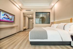 Voodi või voodid majutusasutuse Xiyueliang Hotel Kunming South Asian Style First City Branch toas