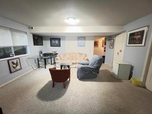 a living room with a couch and a table at Cozy Nook in Fraser Valley Getaway With Breakfast in Abbotsford