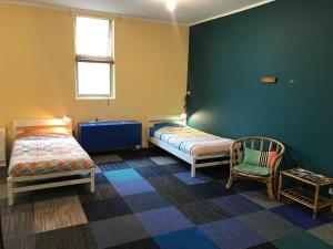 Posteľ alebo postele v izbe v ubytovaní The Cell Block Backpackers