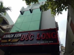 a sign for a big long restaurant in front of a building at Duc Long Airport Hotel in Ho Chi Minh City