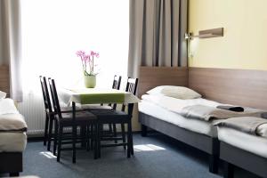 Posteľ alebo postele v izbe v ubytovaní Hostel Azymut